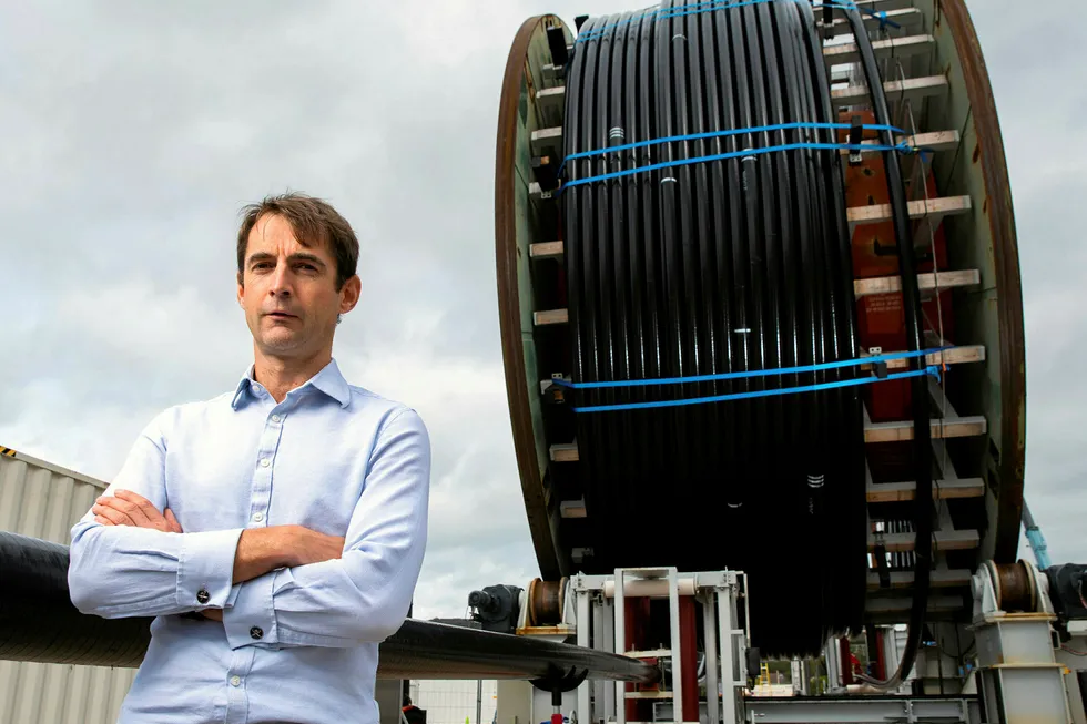 Standing tall: Magma Global chief operating officer Charles Tavner in front of 1500 metres of M-Pipe due to be shipped to Ghana from the company's base in Portsmouth, UK