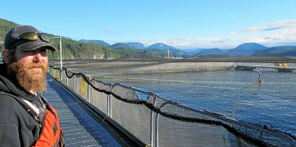 A worker surveys farms at Cermaq Canada.