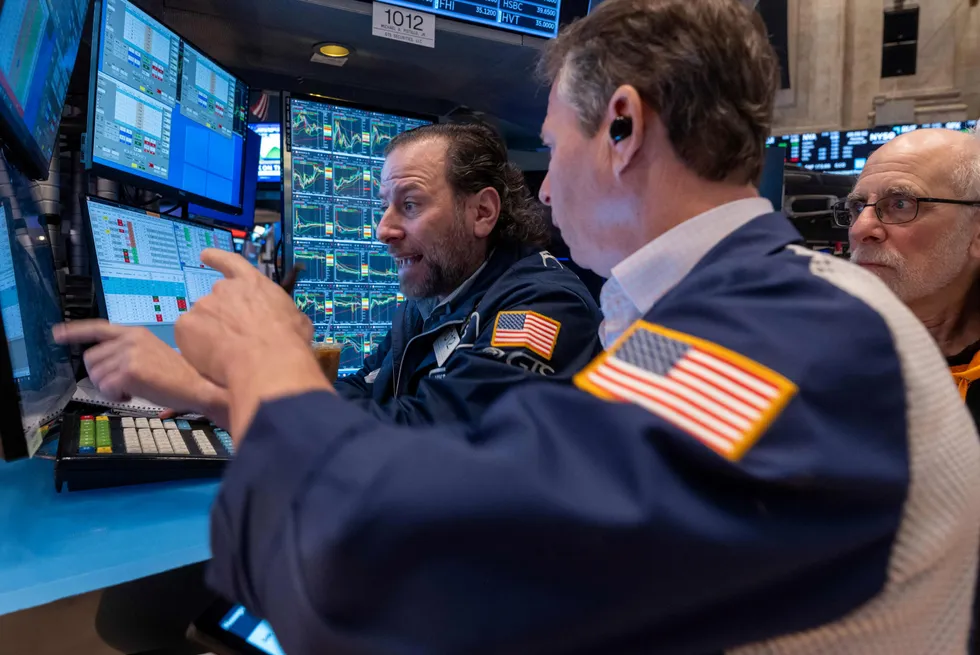 Mini rout: Traders work on the floor of the New York Stock Exchange on Monday.