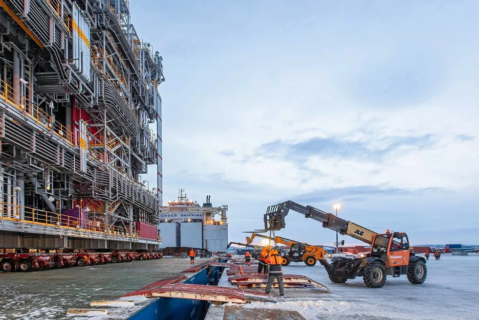 At work: a pre-fabrication module for the first train of the Arctic LNG 2 plant is being prepared to be rolled from a Chinese carrier to the shore at the Belokamenka yard in Russia