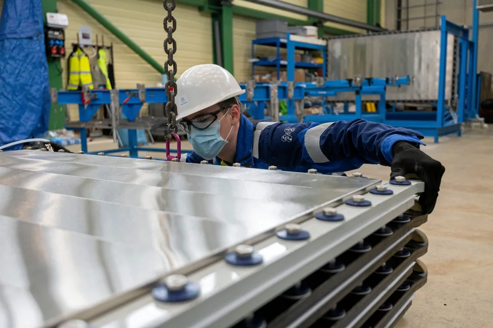 An electrolyser stack being assembled.