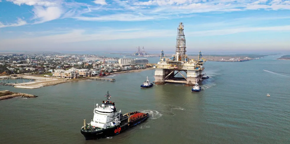 Boats tow a semi-submersible drilling platform through the Port Aransas Channel into the Gulf of Mexico in Port Aransas, Texas. The Gulf is home to waning US hydrocarbons facilities.