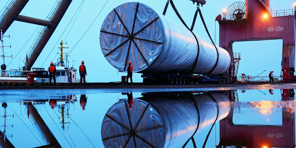 China State Construction company installing an offshore wind tower from Nanjing Habour.