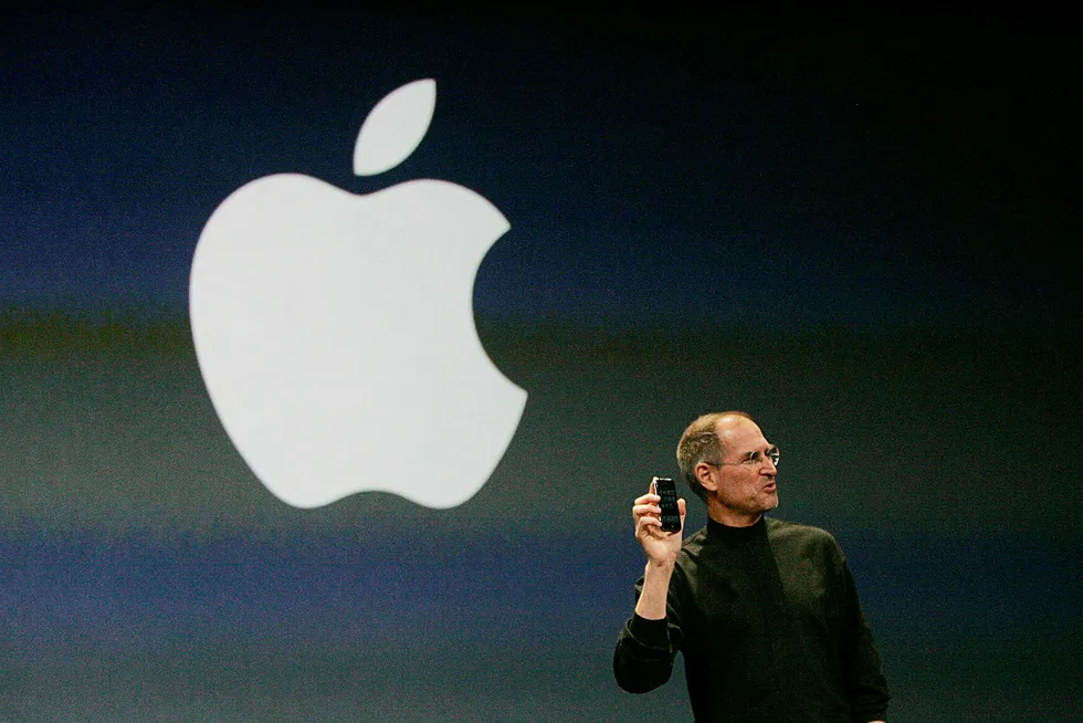Apple Computer Inc. Chief Executive Officer Steve Jobs holds the new iPhone in San Francisco, California January 9, 2007. Apple unveiled an eagerly-anticipated iPod mobile phone with a touch-screen on Tuesday, priced at $599 for 8 gigabytes of memory, pushing the company's shares up as much as 8.5 percent. Jobs said the iPhone, which also will be available in a 4-gigabyte model for $499, will ship in June in the United States. The phones will be available in Europe in the fourth quarter and in Asia in 2008. REUTERS/Kimberly White (UNITED STATES) ---