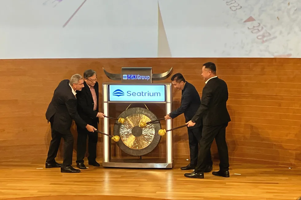 Seatrium chief executive Chris Ong (far right) and Seatrium chairman Mark Gainsborough (far left) at SGX, the Singapore stock exchange.