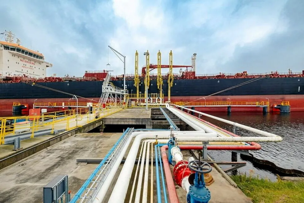 Pipes leading up to a ship docked at the Port of Amsterdam.