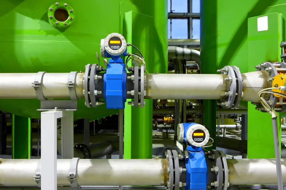 A stock image of pipelines and gas storage facilities.