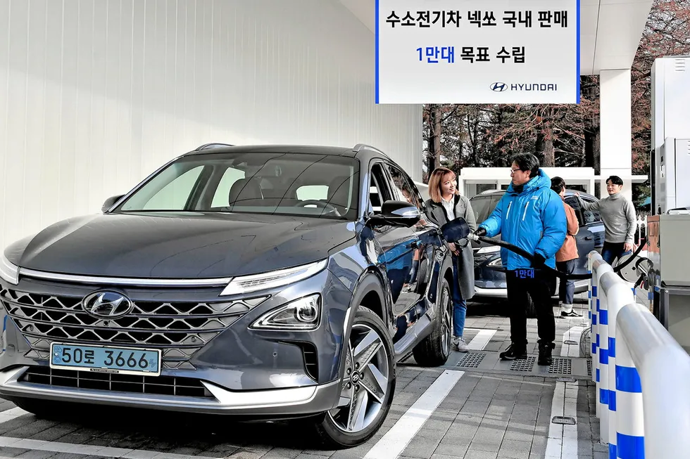 A Hyundai Nexo hydrogen fuel-cell car being refuelled at a South Korean filling station.