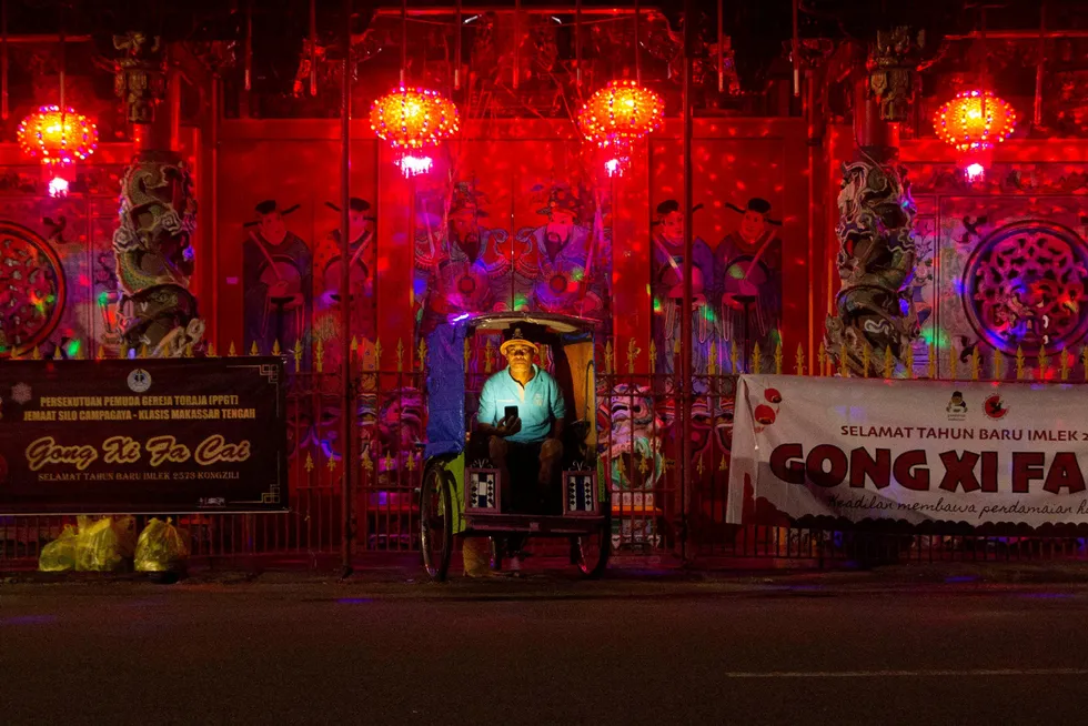 South Sulawesi: a man prays at a temple in the provincial capital Makassar during Lunar New Year
