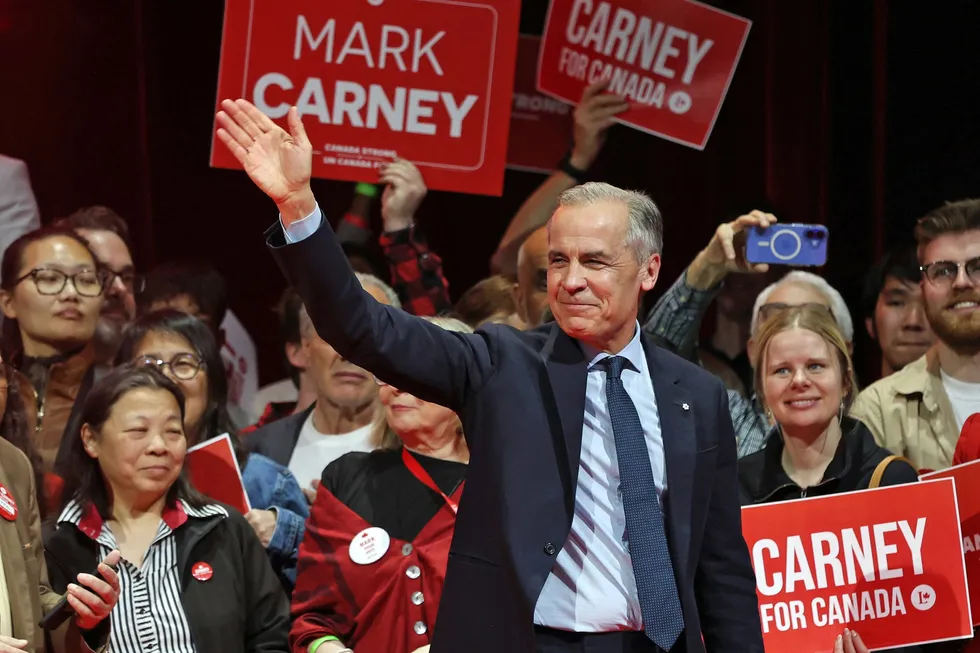 Canada's Prime Minister and Liberal Party leader Mark Carney waves to supporters at a victory party in Ottawa, Ontario