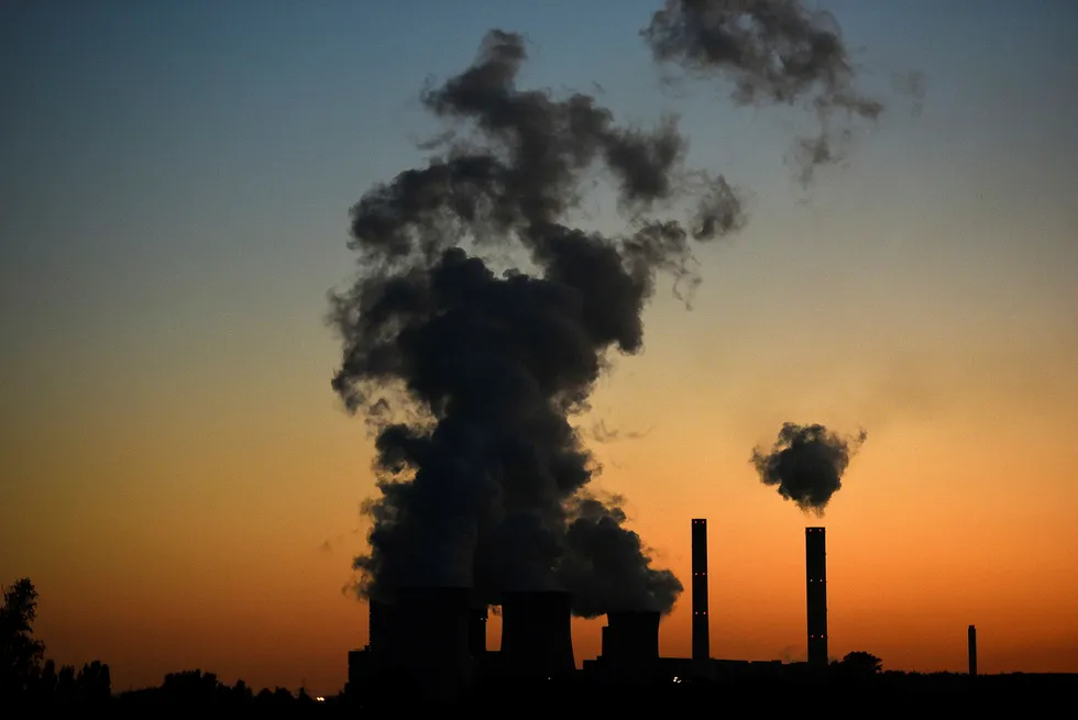 (FILES) This file photograph taken on October 2, 2015, shows smoke rising from the "Weisweiler" power plant which is run on brown coal from an open cast mine in Weisweiler, western Germany. - Avoiding global climate chaos will require a major transformation of society and the world economy that is "unprecedented in scale," the UN said October 8, 2018, in a landmark report that warns time is running out to avert disaster. (Photo by Patrik STOLLARZ / AFP) ---