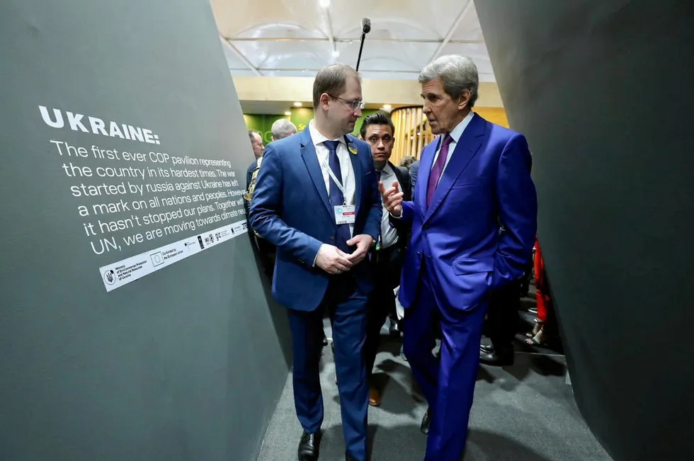 US climate envoy John Kerry, right, meets Ukraine's environmental protection and natural resources minister Ruslan Strilets at the Ukraine pavilion at COP27 in Sharm El-Sheikh, Egypt.