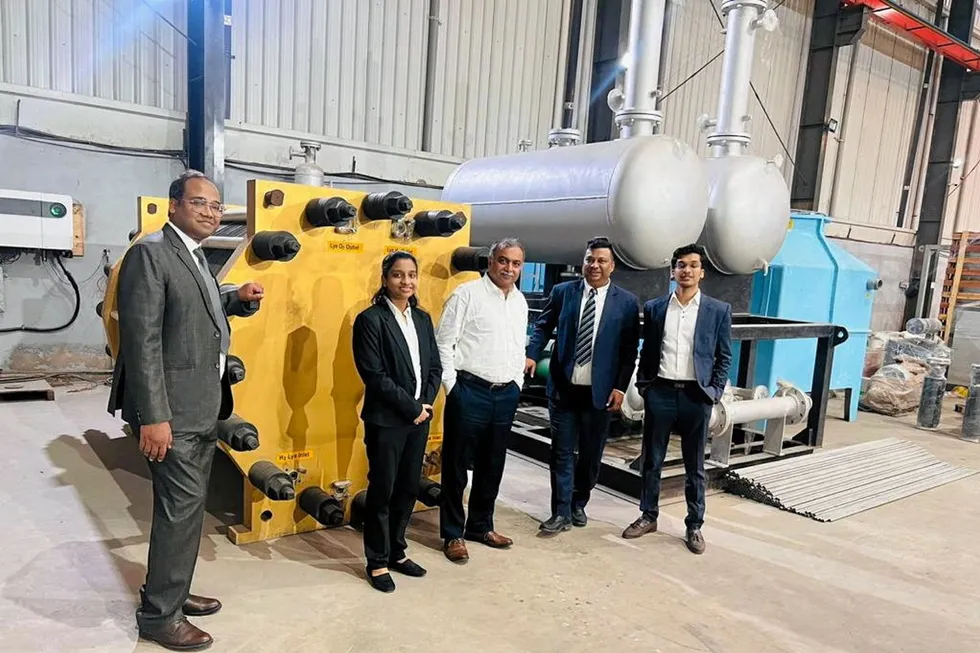Greenzo Energy executives with the company's prototype 1MW electrolyser.