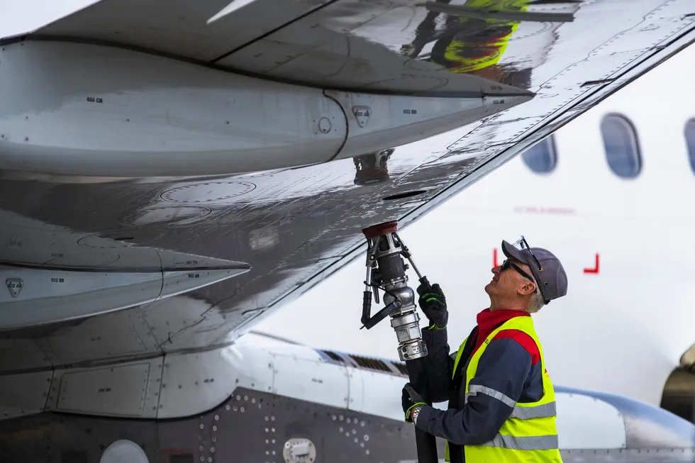 An airplane being filled with conventional jet fuel.