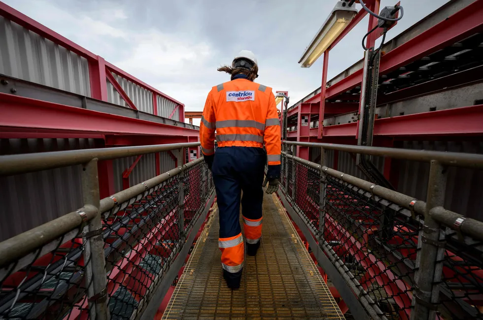 A Centrica worker walks along a gangway on the Rough 47/3B Bravo gas platform, in the UK North Sea. The MESH is set to become a major new UK natural gas and hydrogen energy storage facility, with gas-storage capacity nearly the size of the Rough facility.