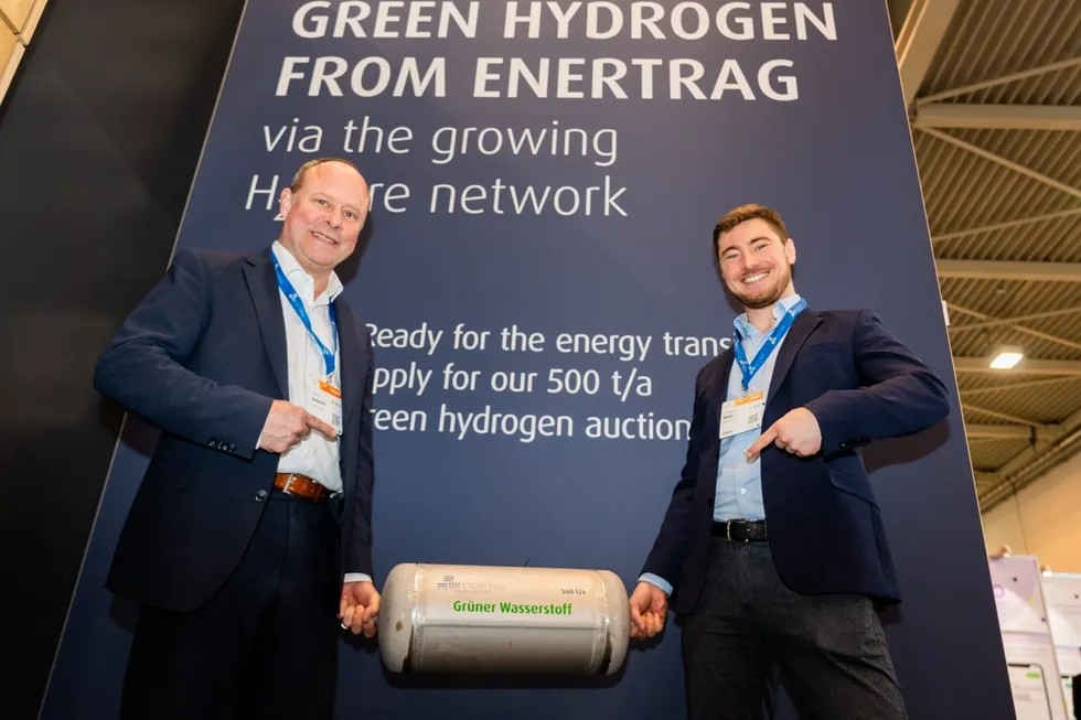 Enertrag workers Tom Barkmann and Leonard Klaas pose at the launch of the auction at the E-world conference in Essen earlier this week.