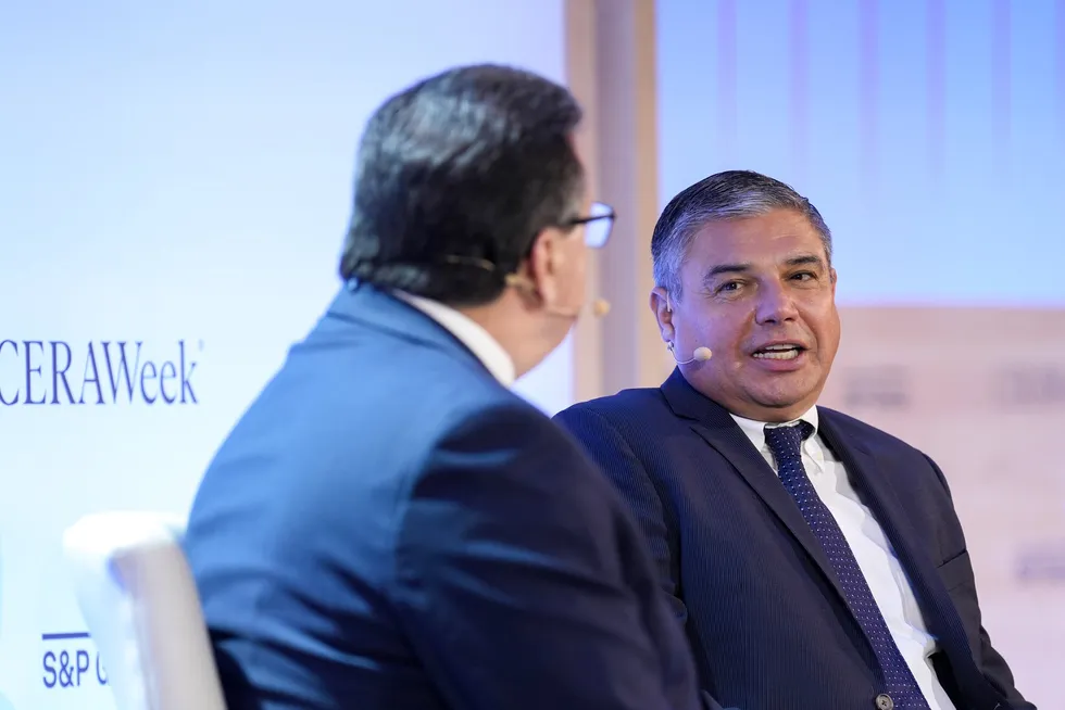 Baker Hughes chief executive Lorenzo Simonelli (right), answers a question during the CERAWeek by S&P Global energy conference in Houston, on Monday.