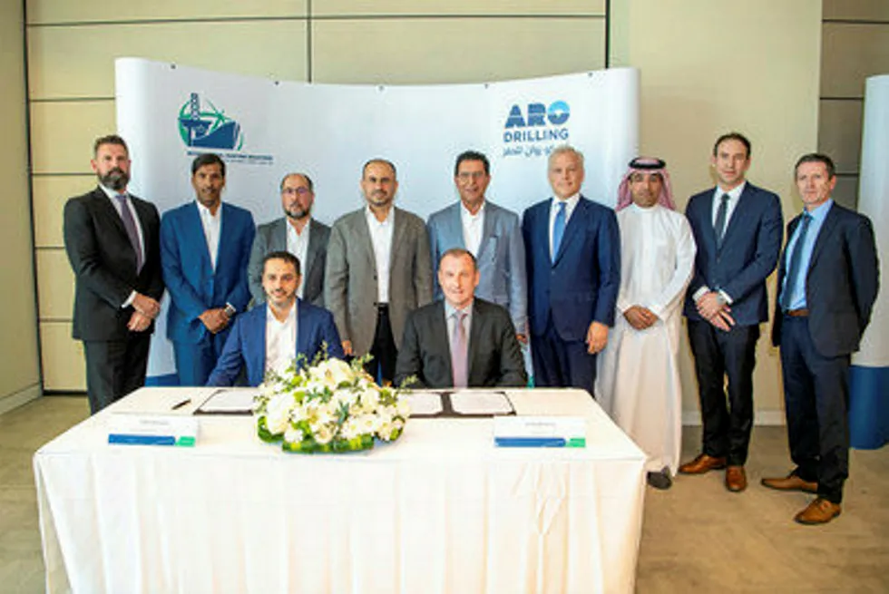 On order: International Maritime Industries chief Fathi Al Saleem and ARO chief executive Kelly McHenry signing the rig orders