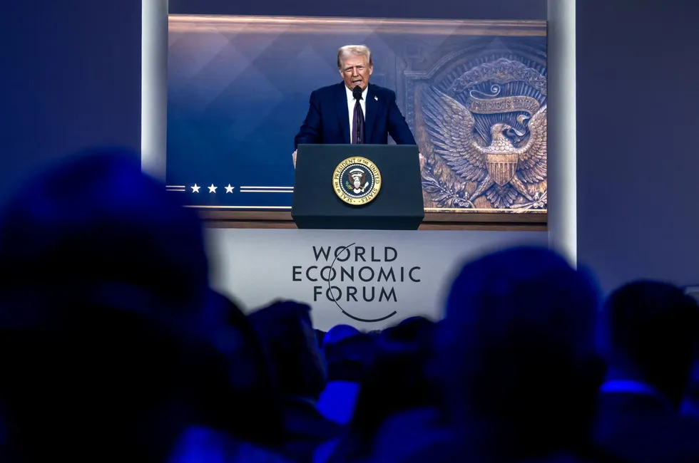 US President Donald Trump is seen on a giant screen during his address by video conference at the World Economic Forum (WEF) annual meeting in Davos on 23 January.