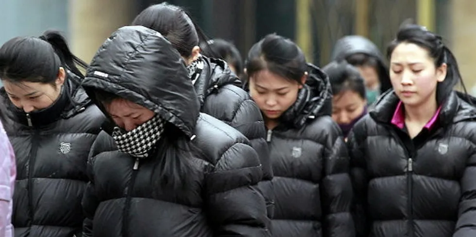 A group of North Korean women in the streets of Dandong, China in March 2023 being overseen by a government minder. The use of such workers in China is in violation of United Nations sanctions.