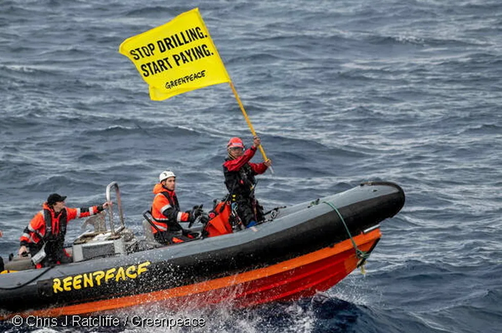 Greenpeace activists target Shell's Penguins FPSO.