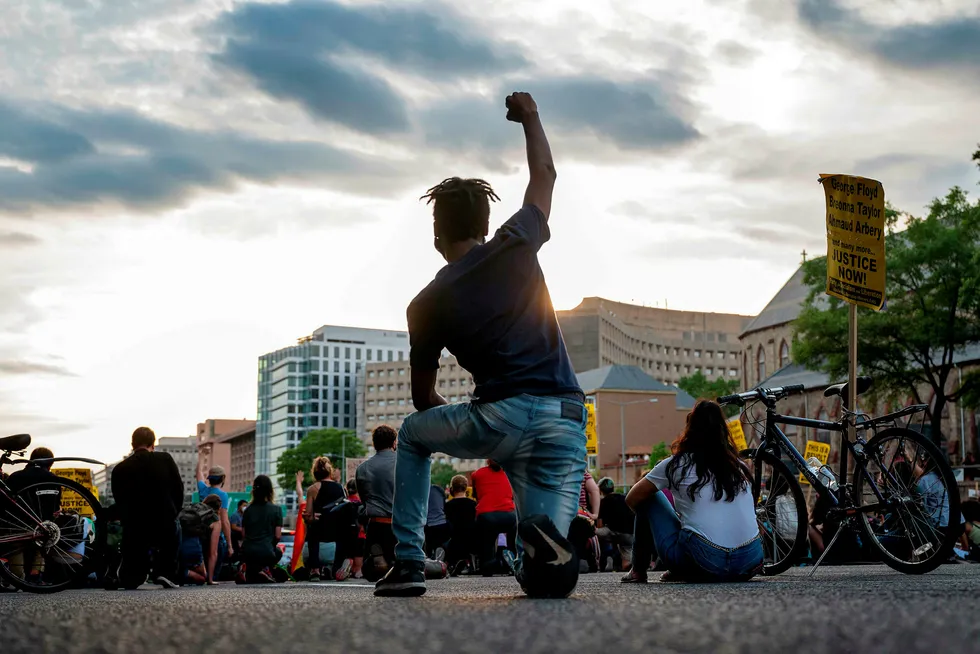 Justice: A protester kneels in Washington, DC