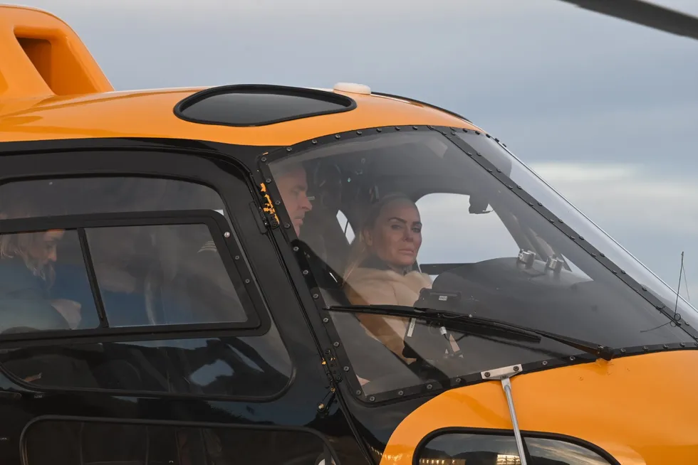 Kathrine Fredriksen arrives by helicopter on the island of Lovund on Jan. 30. The daughter of Norwegian billionaire John Fredriksen, she oversees some of the family's investments, including its stake in salmon farmer Mowi.