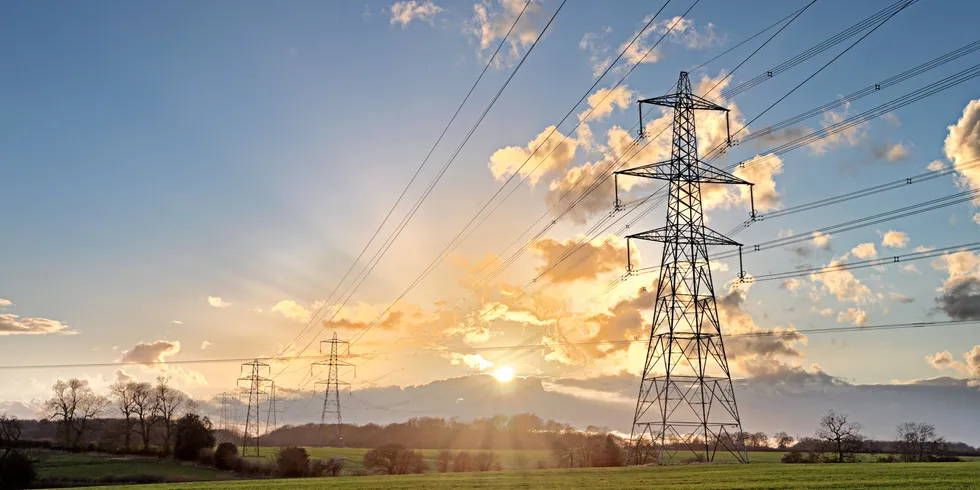 Electricity Pylon - UK standard overhead power line transmission tower at sunset.; Shutterstock ID 185467274; Purchase Order: 1070; Job: Rejlers Reljers. Reljers.
