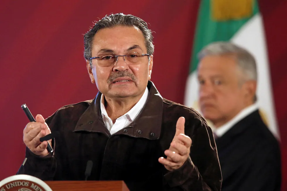 Upbeat: Pemex chief executive officer Octavio Romero gestures, with Mexico's President Andres Manuel Lopez Obrador watching in the background