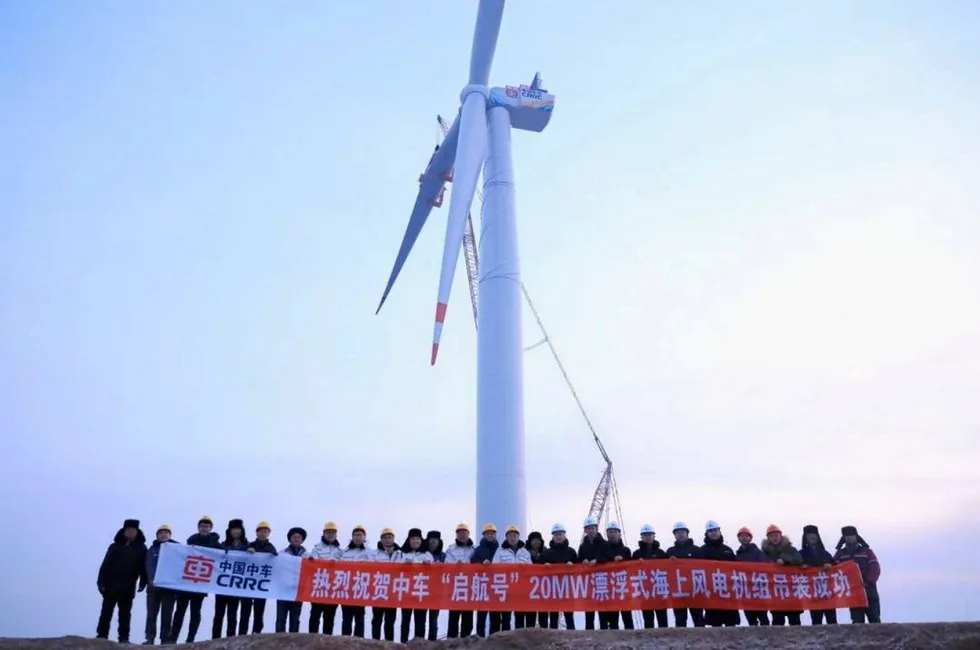 CRRC workers stand in front of the monolithic turbine, installed onshore at its testing base in China's eastern Shandong province.