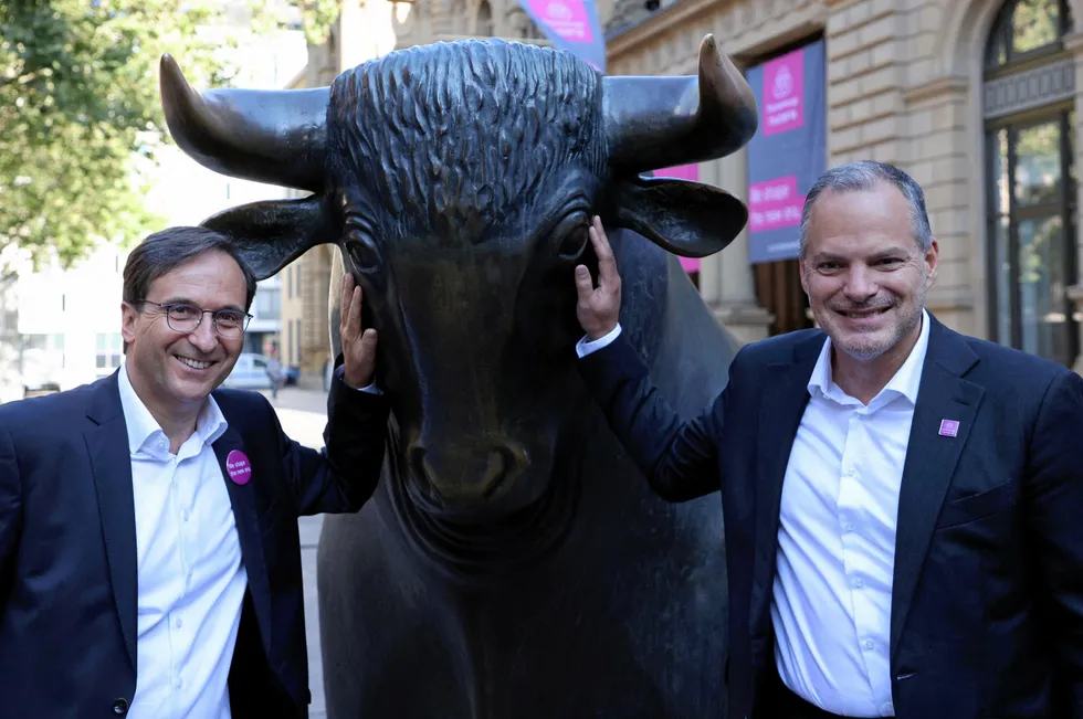 Feeling bullish: Thyssenkrupp Nucera CEO Werner Ponikwar, right, and CFO Arno Pfannschmidt, posing with the bull statue on Wall Street, New York, ahead of Nucera's IPO.