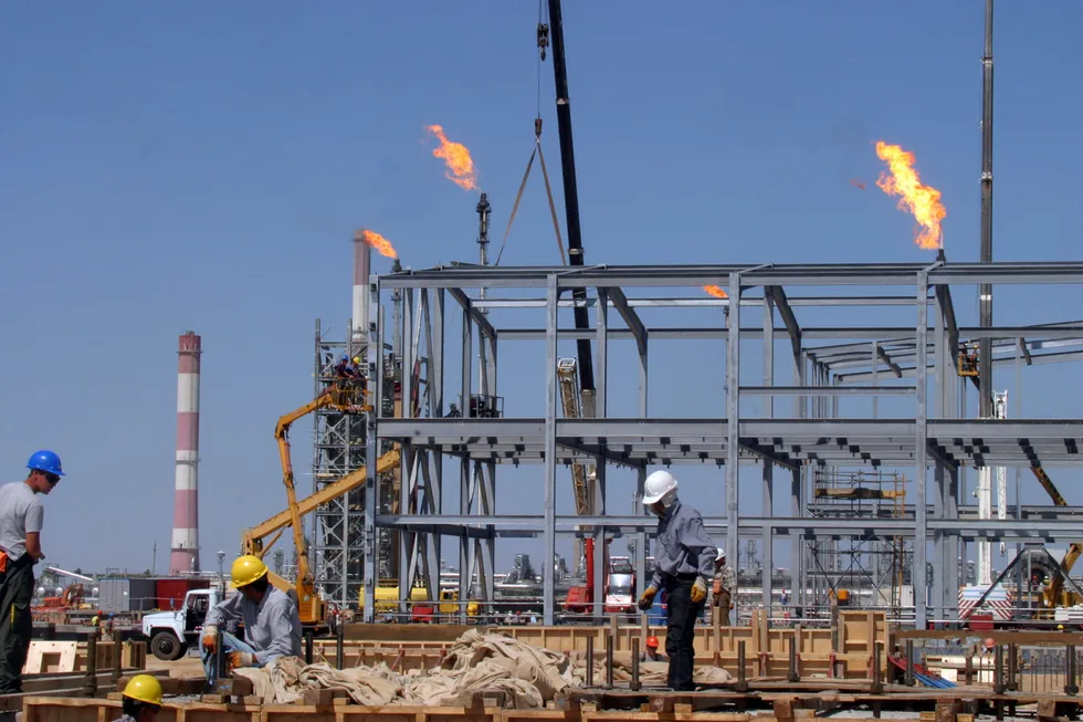 Employment: Kazakh workers seen busy at the Tengiz production expansion project.