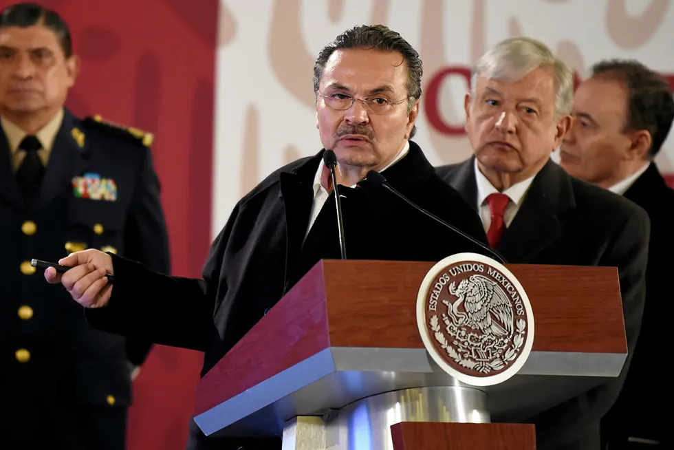 Unbudging: the head of Mexican oil company Pemex, Octavio Romero (centre), watched by Mexican President Andres Manuel Lopez Obrador (immediately right)