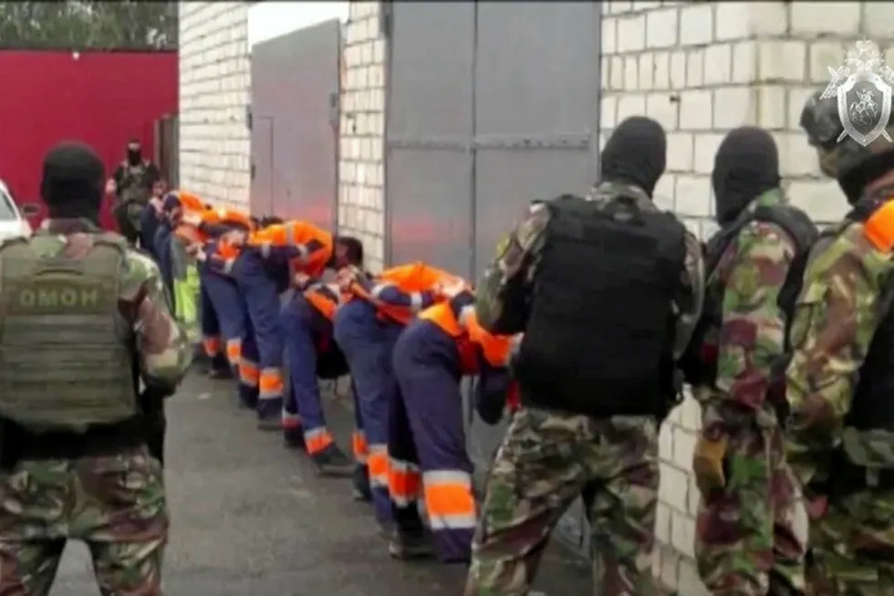 Crackdown: a line of detained protesters at the Amur gas processing plant in Russia