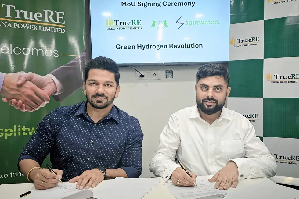 Splitwaters CEO Deepak Bawa, left, and Oriana chief business officer Anirudh Saraswat, signing the agreement.