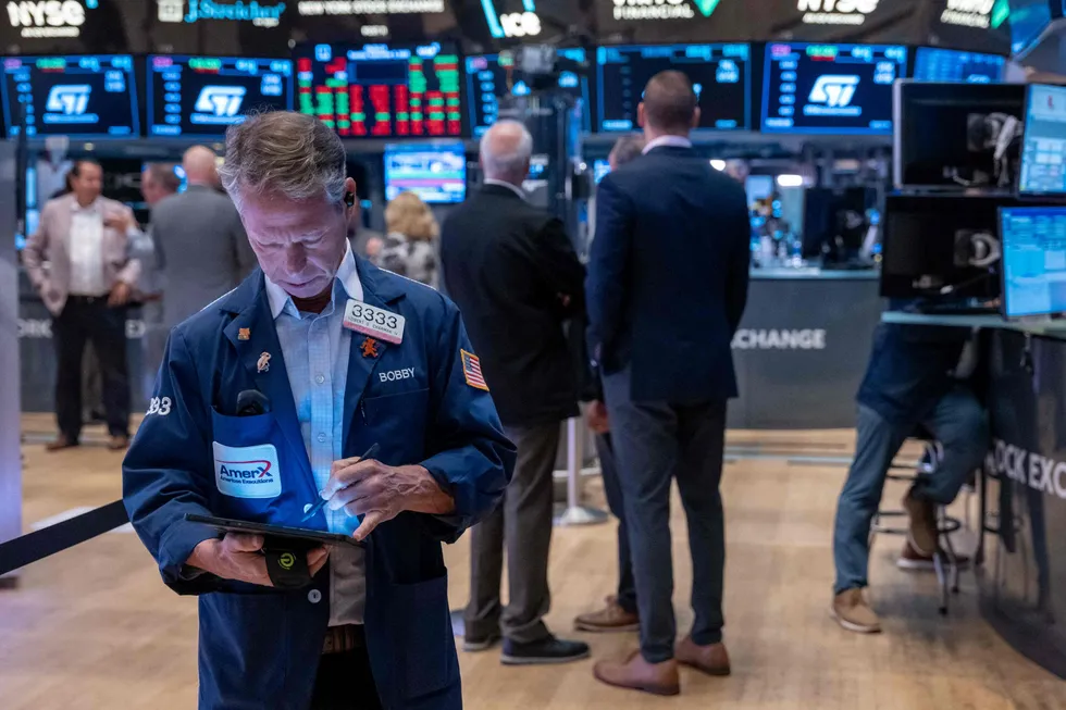 Traders work on the floor of the New York Stock Exchange (NYSE).