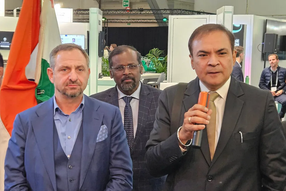 Prashant Kumar Singh, Secretary of India's Ministry of New and Renewable Energy, speaking into an orange microphone at the opening of the India pavilion at European Hydrogen Week last week, alongside Hydrogen Europe CEO Jorgo Chatzimarkakis.