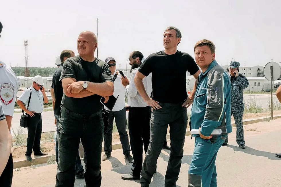Urgent visit: Amur Regional Governor Vasily Orlov (centre) inspects foreign workers' dormitories near the Amur gas processing plant, currently under construction close to the border between Russia and China