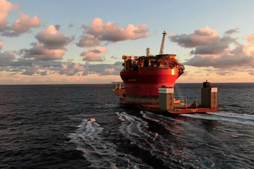 Approach: Greenpeace activists on boats target a Boskalis heavy-lift vessel carrying a Shell FPSO destined for a UK project.