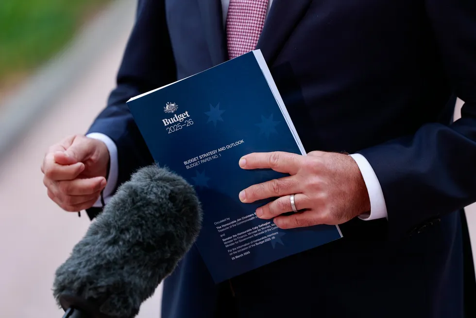 A copy of the Federal Budget in the hands of Australia's treasury chief Jim Chalmers