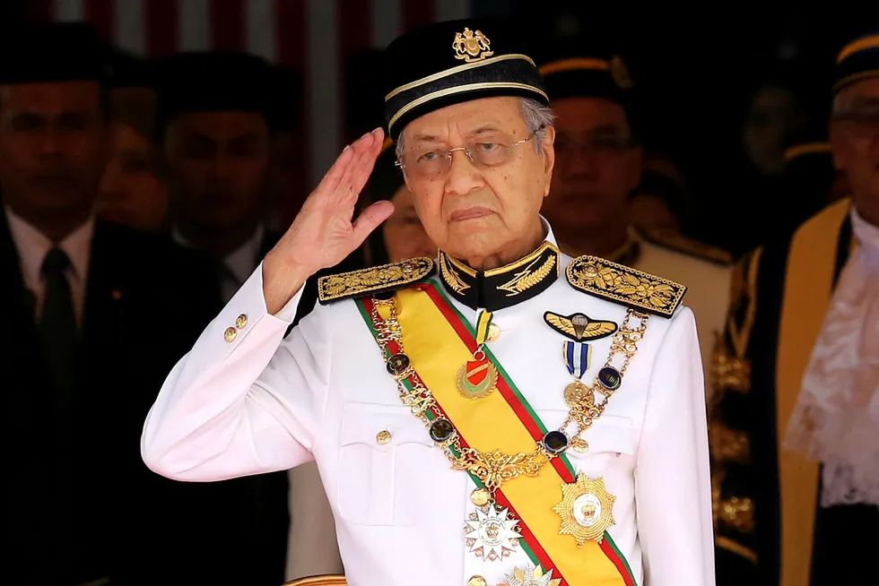 In the spotlight: Malaysian Prime Minister Mahathir Mohamad salutes during the opening of the 14th parliament session in Kuala Lumpur