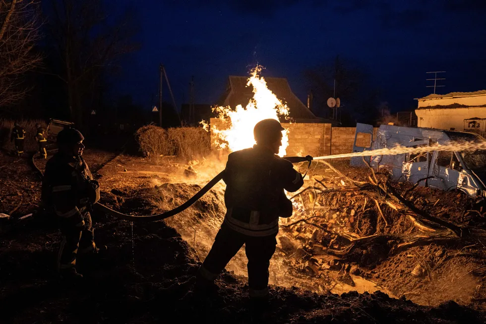 Fighting devastation: a rescue worker puts out the fire of a destroyed gas distribution point at the residential neighbourhood after Russian attack in Kostiantynivka, Ukraine, in March 2023.