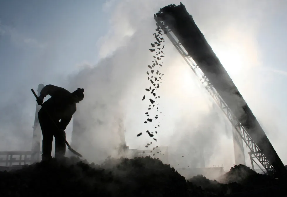 Increase: a labourer works at a coal factory in north-west China’s Xinjiang Uygur Autonomous Region.