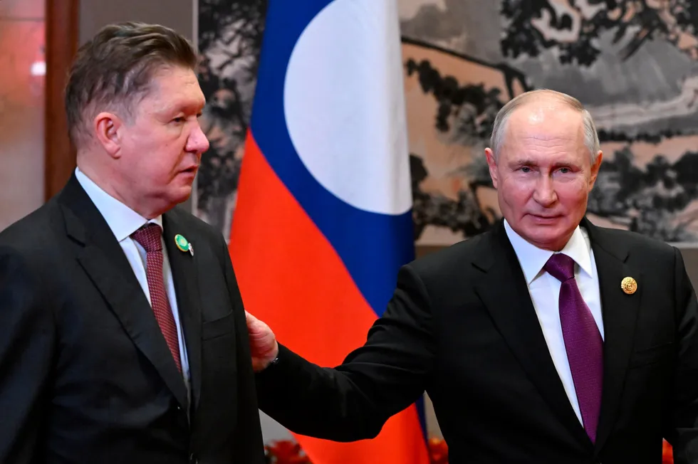 Gazprom executive chairman Alexei Miller (left) with Russian President Vladimir Putin.