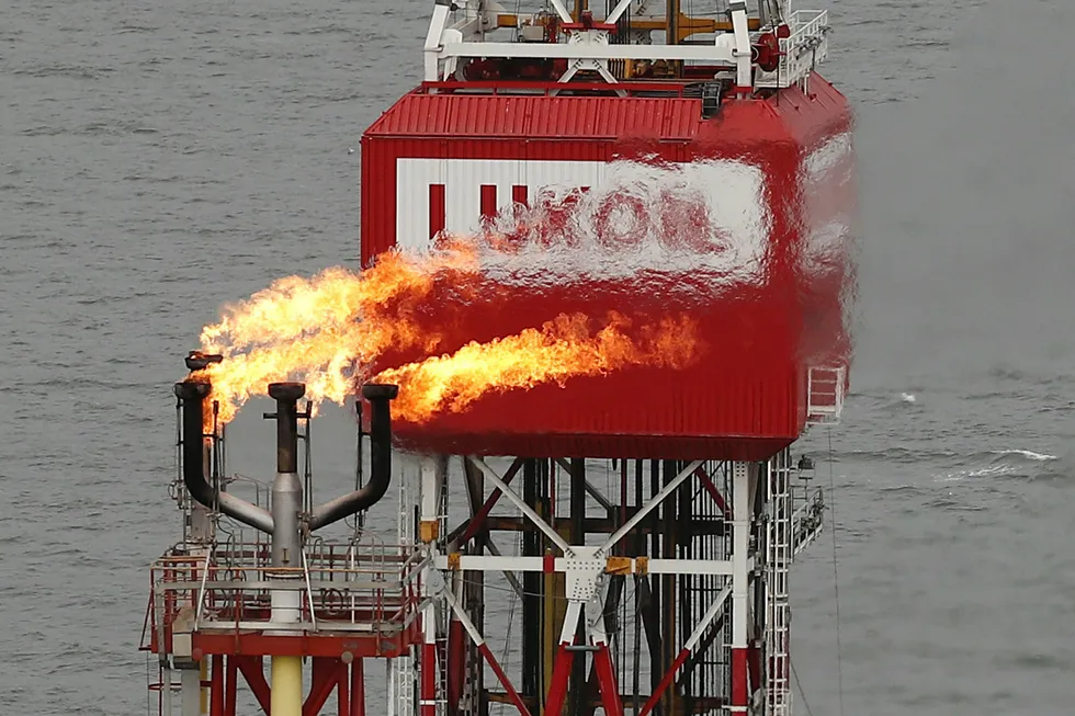 Tough times: Gas is flared at the Filanovskogo oil production platform, operated by Lukoil in the Russian sector of the Caspian Sea