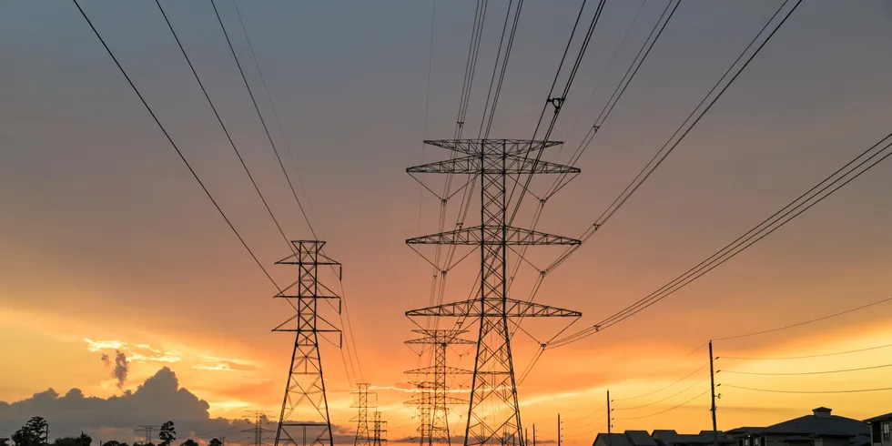 Transmission towers at sunset in Humble, Texas, US