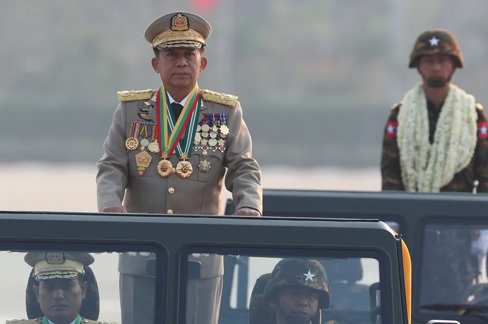 Military might: Min Aung Hlaing, chairman of Myanmar's State Administration Council, inspects officers during a parade.