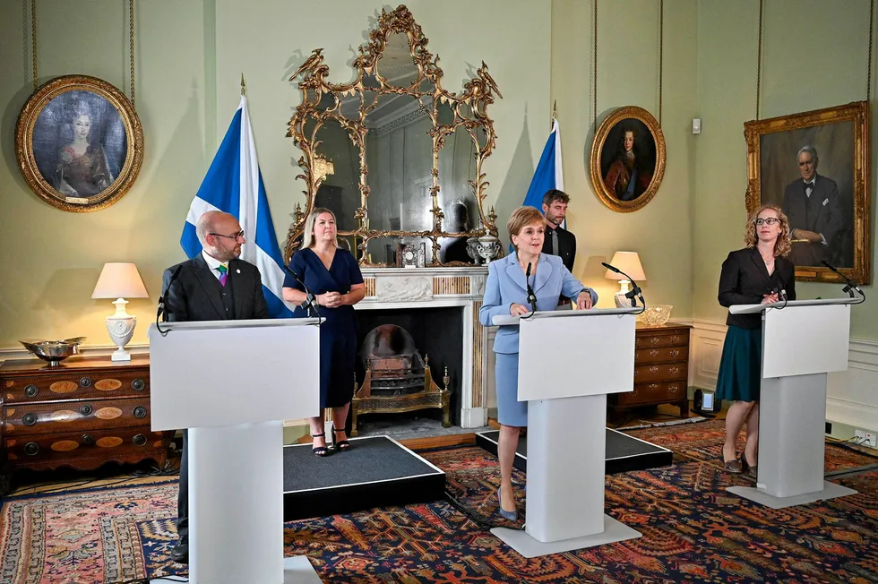 Historic deal: Scotland's First Minister and leader of the Scottish National Party, Nicola Sturgeon (centre), holds a media briefing with Scottish Greens co-leaders Patrick Harvie (left) and Lorna Slater (right)
