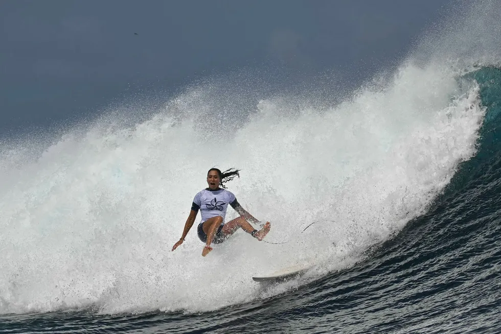 TOPSHOT - French surfer Vahine Fierro takes part in a surfing training session in Teahupo'o, on the French Polynesian Island of Tahiti on July 21, 2024, ahead of the Paris 2024 Olympic Games. (Photo by Jerome BROUILLET / AFP)