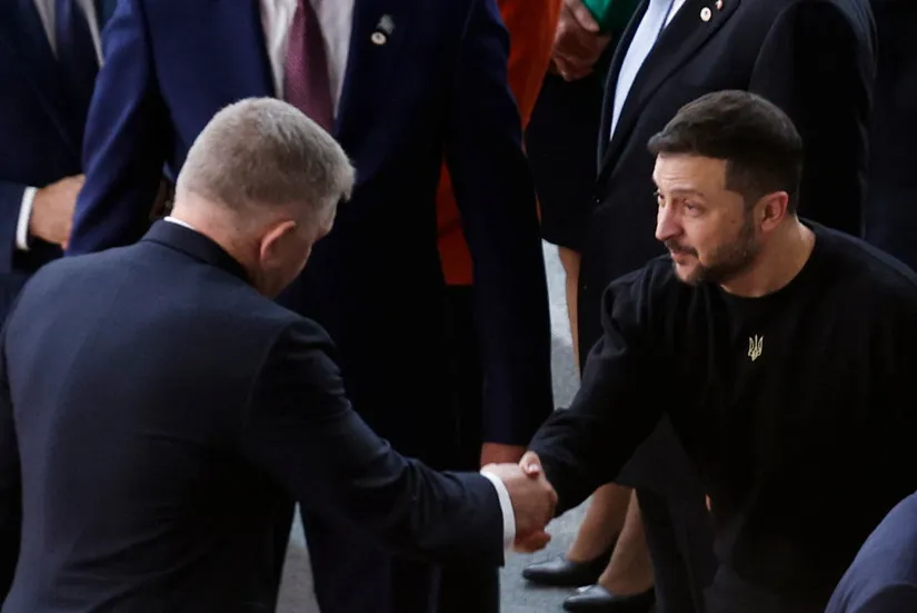 Ukraine's President Volodymyr Zelensky (right) shakes hands with Slovakia's Prime Minister Robert Fico (left) in Brussels in October 2024.